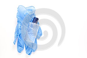 Alcohol liquid sanitizer and blue medical gloves for medical purpose and anti coronavirus COVID-19, white background. Copy space