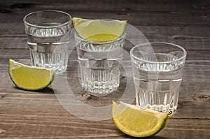 Alcohol shots on wooden bar counter/Alcohol shots on wooden bar counter. selective focus