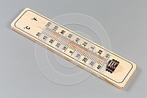 Alcohol thermometer with wooden base and Celsius and Fahrenheit scales