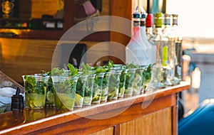 Alcoholic Beverages Lined Up on a Bar