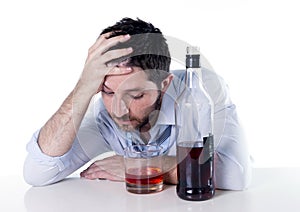 Alcoholic Businessman drunk at desk on white background
