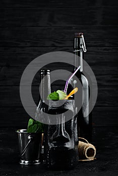 Alcoholic cocktail in a black