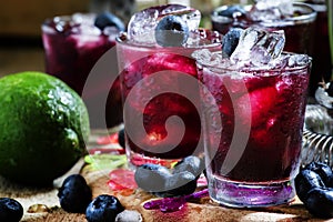 Alcoholic cocktail Darkside, with liqueur, blueberry, lime juice