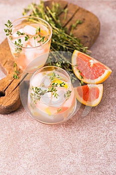 Gin bitter lemon with thyme and grapefruit. Fruit lemonade.