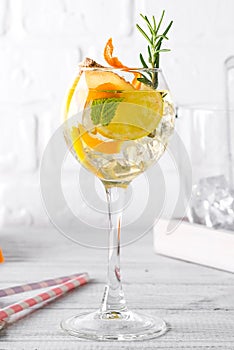 Alcoholic cocktail of the Godfather with orange and ice, isolated on white background