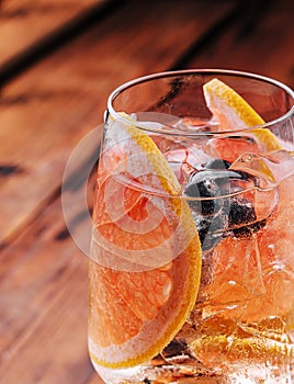 Alcoholic cocktail with grapefruit, soda, ice and gin