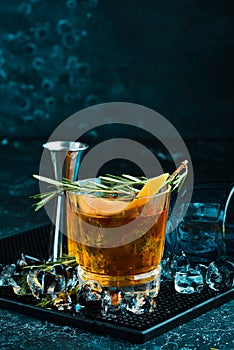 Alcoholic cocktail negroni with orange peel. On a black background. Top view