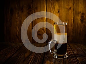 Alcoholic cocktail shot B52 on wooden vintage surface background