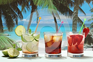 Alcoholic cocktails with fruit on the beach