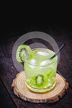alcoholic drink based on kiwi and Aguardente  cocktail based on distilled drink and fruits  called caipirinha in Brazil and in photo