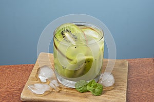 alcoholic drink caipirinha based on kiwi and aguardente distilled cocktail drink and fruits photo