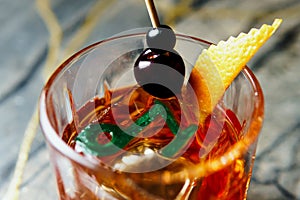 Alcoholic drink. A cocktail with elite alcohol on dark black background