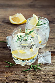 Alcoholic drink with lemon, rosemary