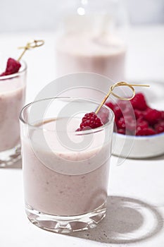 Alcoholic drink with raspberries. Milkshake with berries for decoration