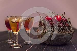 Alcoholic drinks in glass piles on a wooden table.
