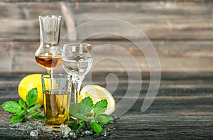 Alcoholic drinks ice lemon mint leaves whiskey gin rum vodka