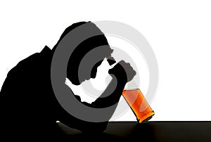 Alcoholic drunk man with whiskey bottle in alcohol addiction silhouette