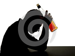 Alcoholic drunk man with whiskey bottle in alcohol addiction silhouette