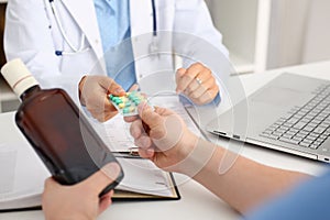 Alcoholic hold in hand empty bottle at doctor reception office