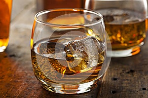 Alcoholic Whiskey Bourbon in a Glass with Ice