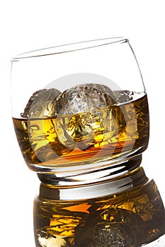 Alcoholic Whiskey Bourbon in a Glass with Ice