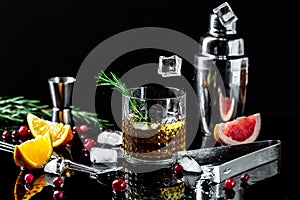 Alcoholism, alcohol addiction and people concept - male alcoholic with bottle and glass drinking whiskey at night.Businessman