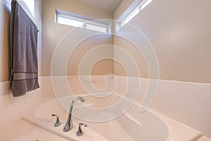 Alcove bathtub with widespread stainless steel faucet