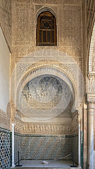 Alcove with Carved wooden tiles and glazed tiles in the Alhambra in Granada, Spain.