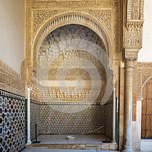Alcove with Carved wooden tiles and glazed tiles in the Alhambra in Granada, Spain.