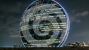 The Aldar headquarters building night timelapse is the first circular building of its kind in the Middle East in Abu