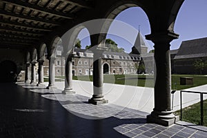Alden Biesen castle seen from the covered courtyard with colonnade in Belgium