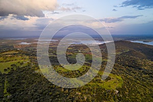 Alentejo drone aerial view of the landscape at sunset with alqueva dam reservoir, in Portugal