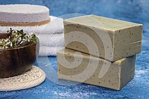 Aleppo soap and dray Laurus nobilis flower in a wooden plate