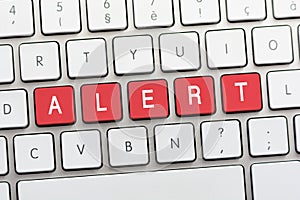 ALERT writing on white keyboard