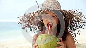 Alex Portrait of pretty woman face with big straw hat and bright makeup on a beach. Girl with sand all over her face and