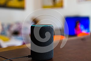 Alexa smart home assistant device by Amazon connected in living room