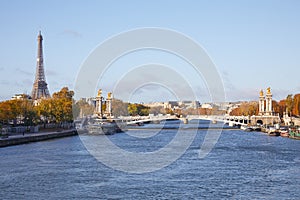 Alexander III bridge, Eiffel tower and Seine river view in a sunny day in Paris, France