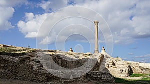 Alexandria Egypt Pompey`s Pillar far view with cloudy blue sky