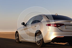 Alfa Romeo Giulia standing in the middle of the desert