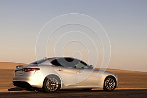 Alfa Romeo Giulia standing in the middle of the desert