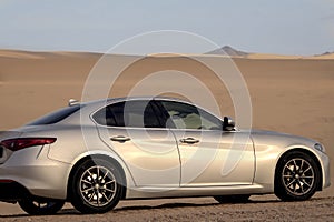 Alfa Romeo Giulia standing in the middle of the desert