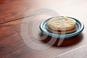 Alfajor of chia seeds on wooden table with copy text