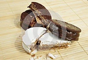 Alfajor of chocolate and powdered sugar