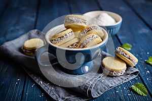 Alfajore cookies filled with caramelized milk and coconut