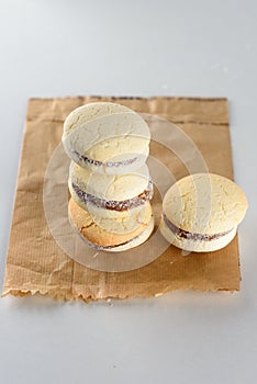 Alfajores, shortbread cookies filled with caramel and rolled in coconut.