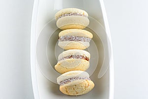 Alfajores, shortbread cookies filled with caramel and rolled in coconut.