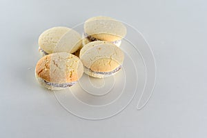 Alfajores, shortbread cookies filled with caramel and rolled in coconut.