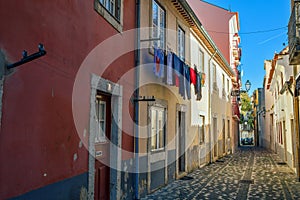 Alfama Lisboa district narrow street colored houses. Lisbon, Portugal