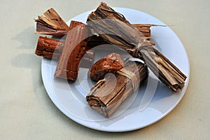 AlfaÃ±ique is a type of palo negro or jam from Spain based on pure cane sugar prepared into an elongated and twisted paste to photo