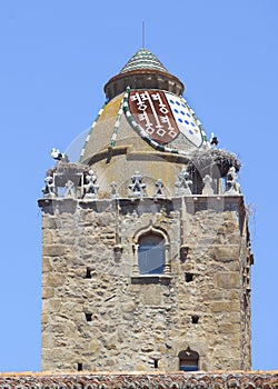 Alfiler tower, Gothic belfry adorned with glazed roof tiles, Trujillo, Spain photo